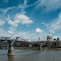 Summer Study Abroad St Paul's Cathedral and bridge over the river Thames, blue sky above.