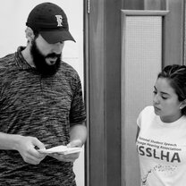 NSSLHA man reading from cards