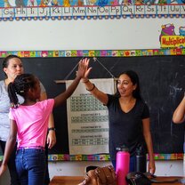 School Visits girl high fiving